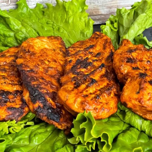 Southwest grilled chicken on a bed of lettuce.