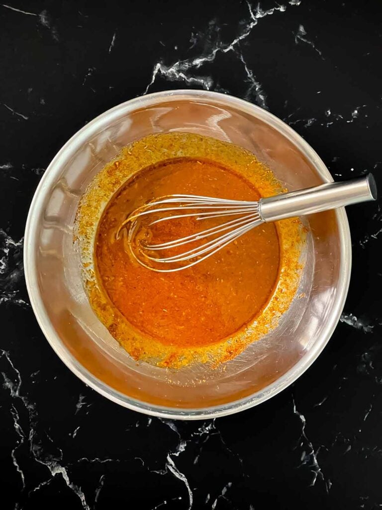 Southwest marinade ingredients whisked together in a bowl.