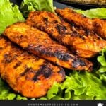 Grilled Southwest chicken with roasted corn in the background.