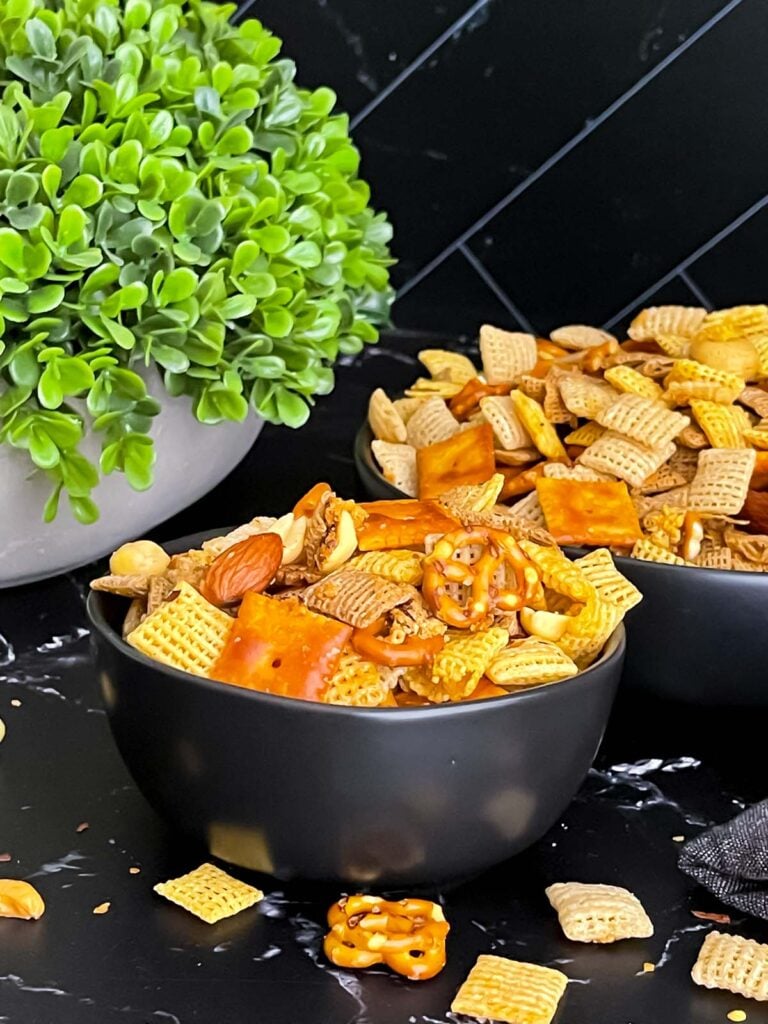 Firecracker Chex Mix in a dark bowl.
