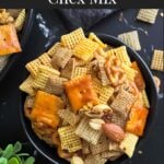 Firecracker Chex Mix in a dark bowl.