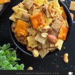 Firecracker Chex Mix in a dark bowl.