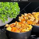 Firecracker Chex Mix in a dark bowl.