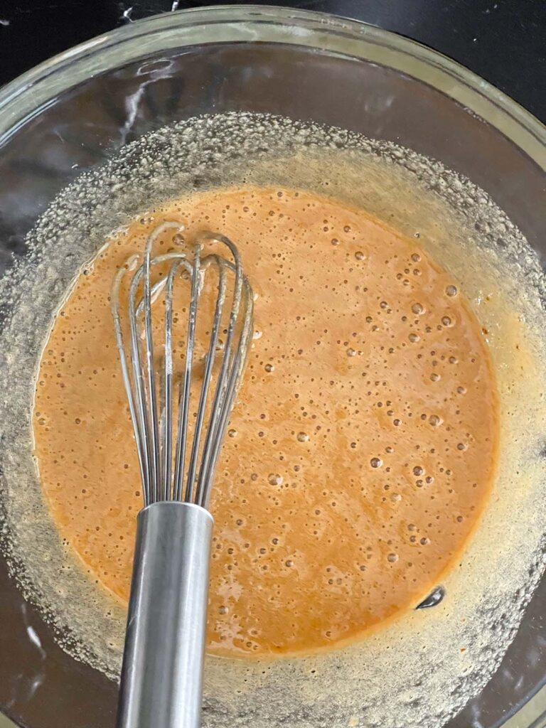 Wet ingredients in a glass bowl.