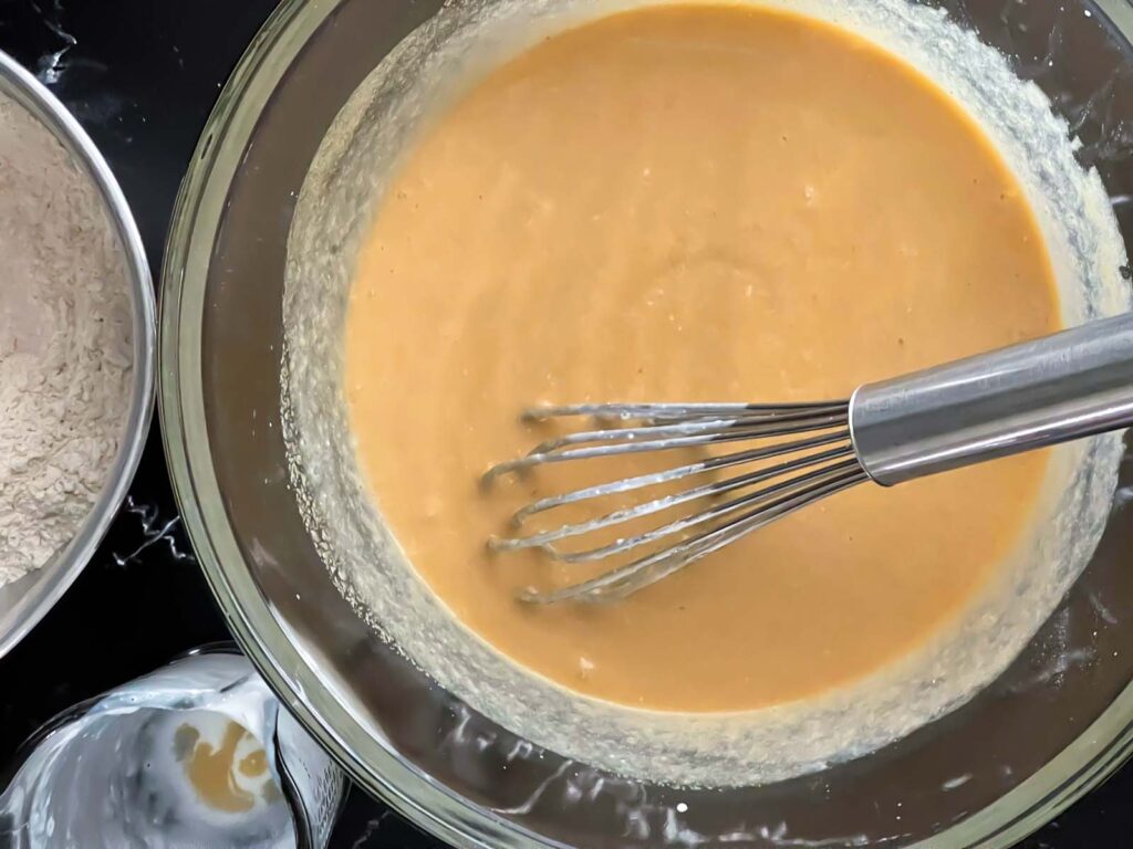 Wet ingredients in a large glass bowl.