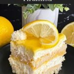 Limoncello tiramisu serving on a dark plate on a dark surface.