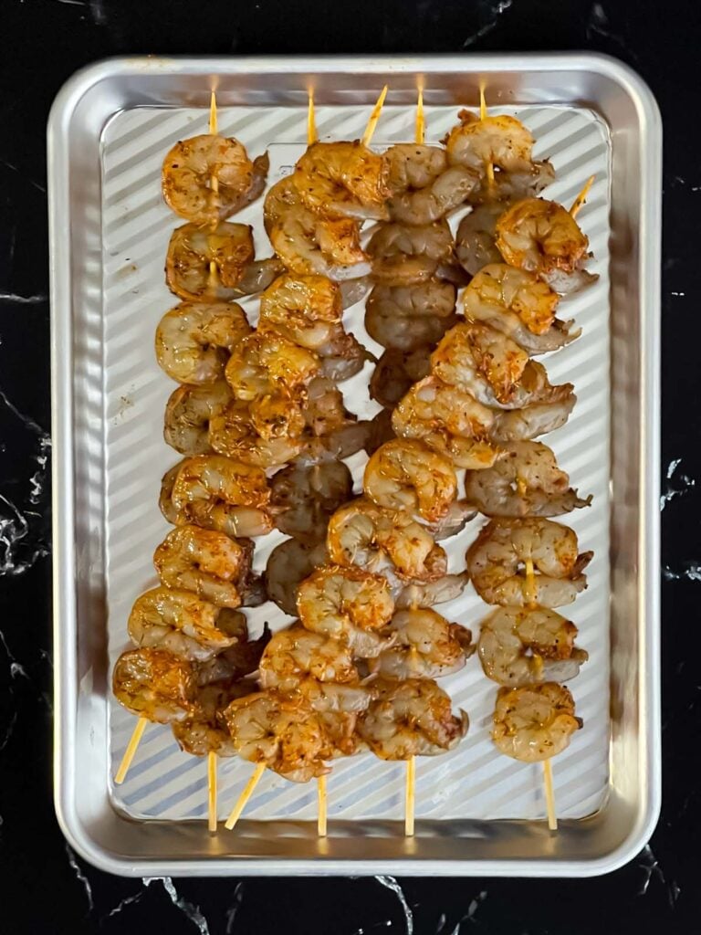 Raw shrimp on skewers.