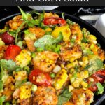 Shrimp and corn salad in a dark bowl.