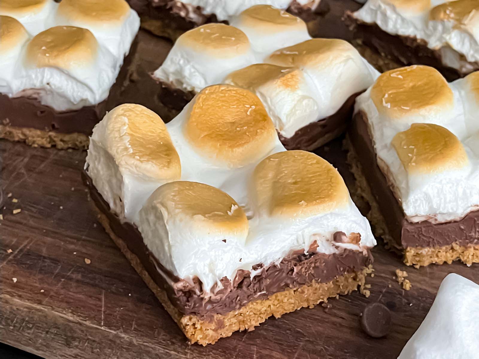 Sliced s'mores on a wooden board.