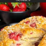 Strawberry scones on a dark plate.