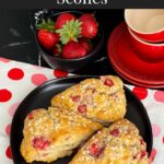 Strawberry scones on a dark plate.