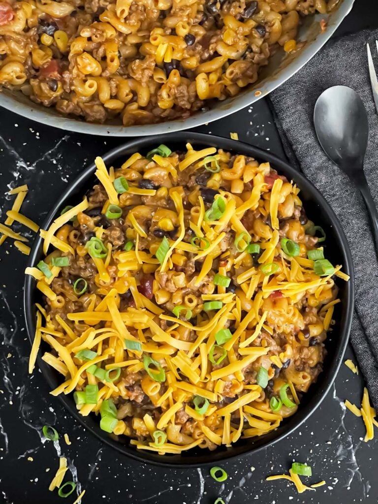 Taco pasta skillet dinner in a dark bowl.