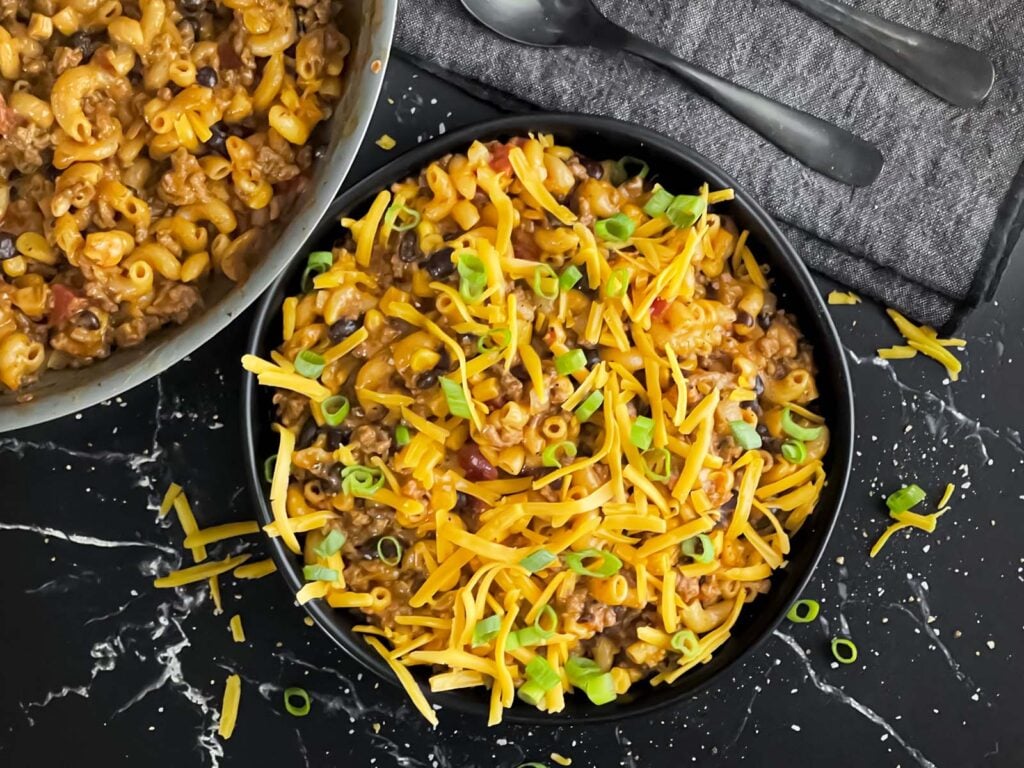 Taco pasta skillet dinner in a dark bowl.