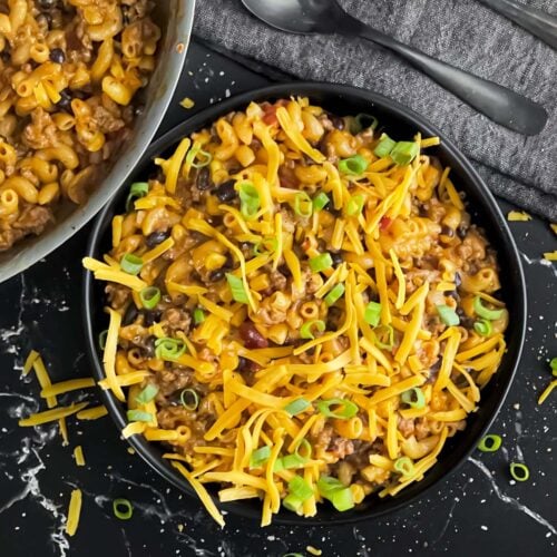 Taco pasta skillet dinner in a dark bowl.