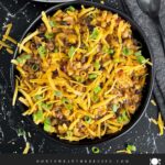 Taco pasta skillet dinner in a dark bowl.