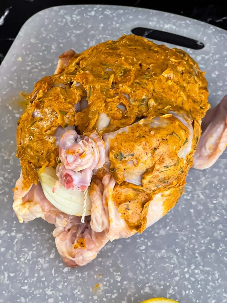Lemon herb butter mixture spread over the whole chicken before placing in the slow cooker.