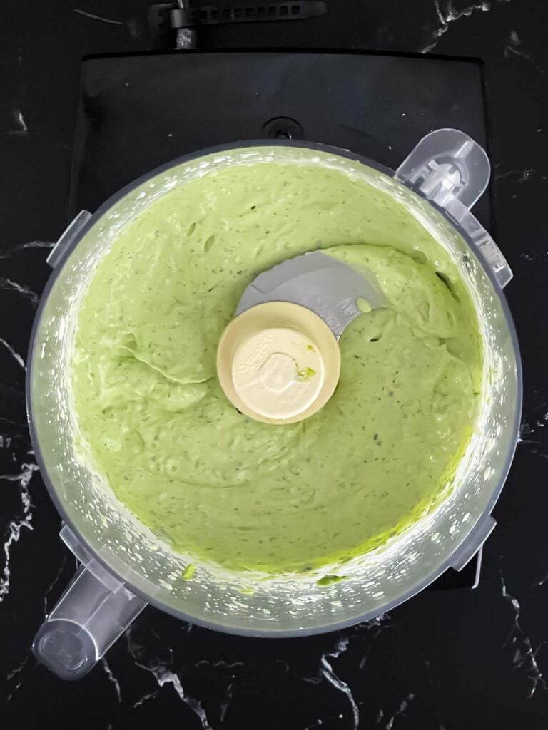 An avocado sauce in a food processor.