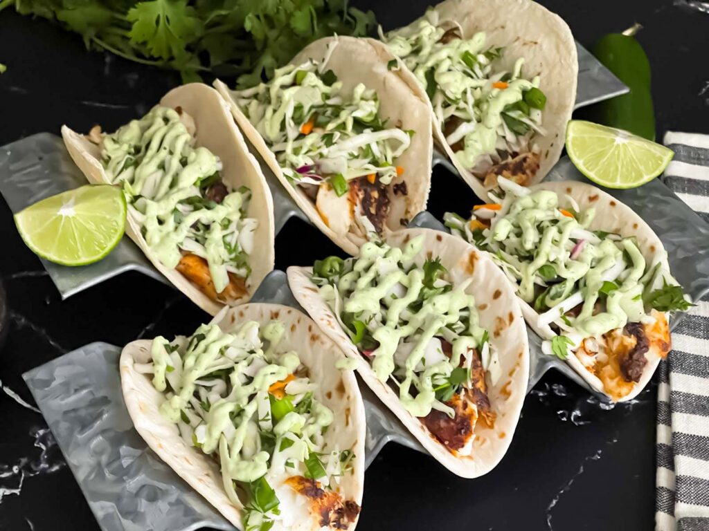 Blackened Fish Tacos on a dark background.