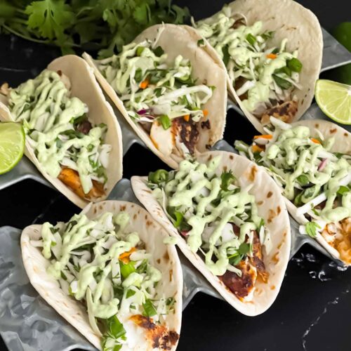 Blackened Fish Tacos on a dark background.