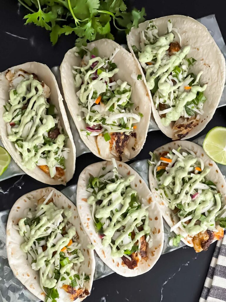 Blackened Fish Tacos on a dark background.