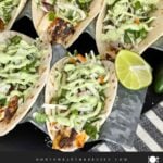 Blackened Fish Tacos on a dark background.