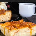 Bread pudding on a dark plate with a bourbon sauce drizzled over it.