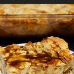 Bread pudding on a dark plate with a bourbon sauce drizzled over it.