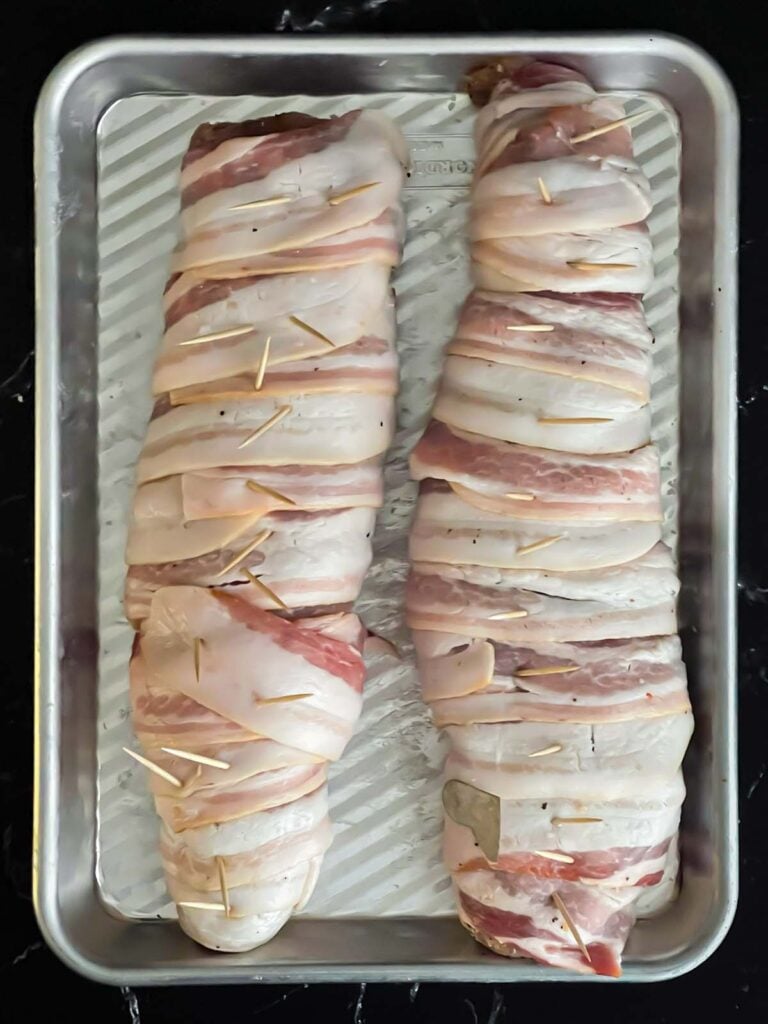 Pork tenderloins wrapped in bacon.