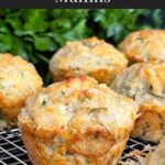 Herb and cheese muffins on a wire rack.