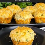 Herb and cheese muffin on a dark plate.