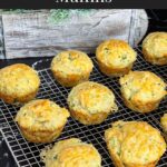 Herb and cheese muffins on a wire rack.