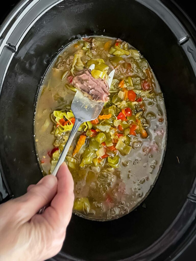 Cooked Italian beef in the slow cooker.