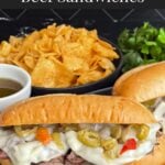 Italian beef sandwiches on a dark plate.
