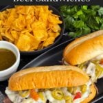 Italian beef sandwiches on a dark plate.