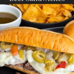 Italian beef sandwiches on a dark plate.