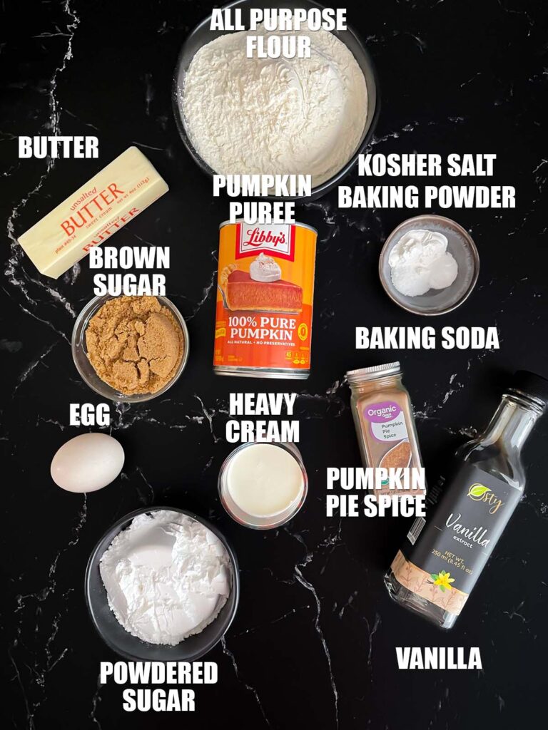 Pumpkin scones recipes ingredients on a dark surface.