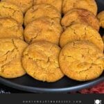 Pumpkin Snickerdoodles on a dark plate.