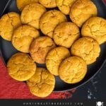 Pumpkin Snickerdoodles on a dark plate.