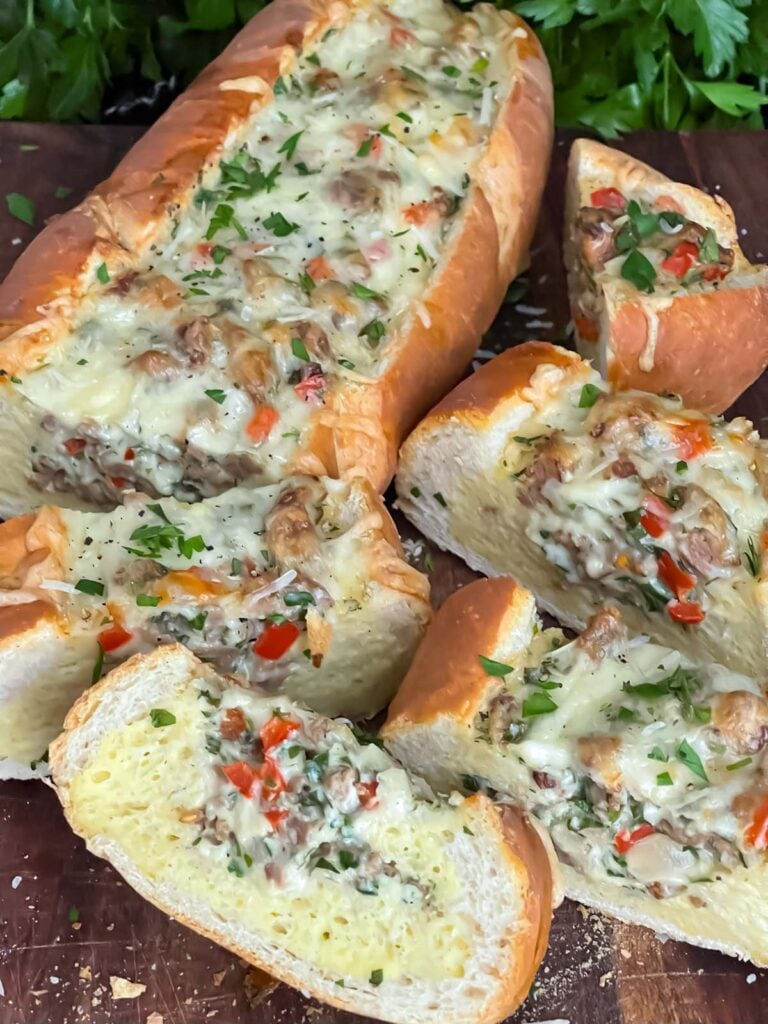 Sausage and Egg Baguette Bake cut up on a cutting board.