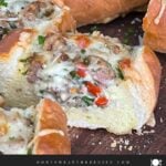 Sausage and Egg Baguette Bake cut up on a cutting board.