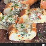 Sausage and Egg Baguette Bake cut up on a cutting board.