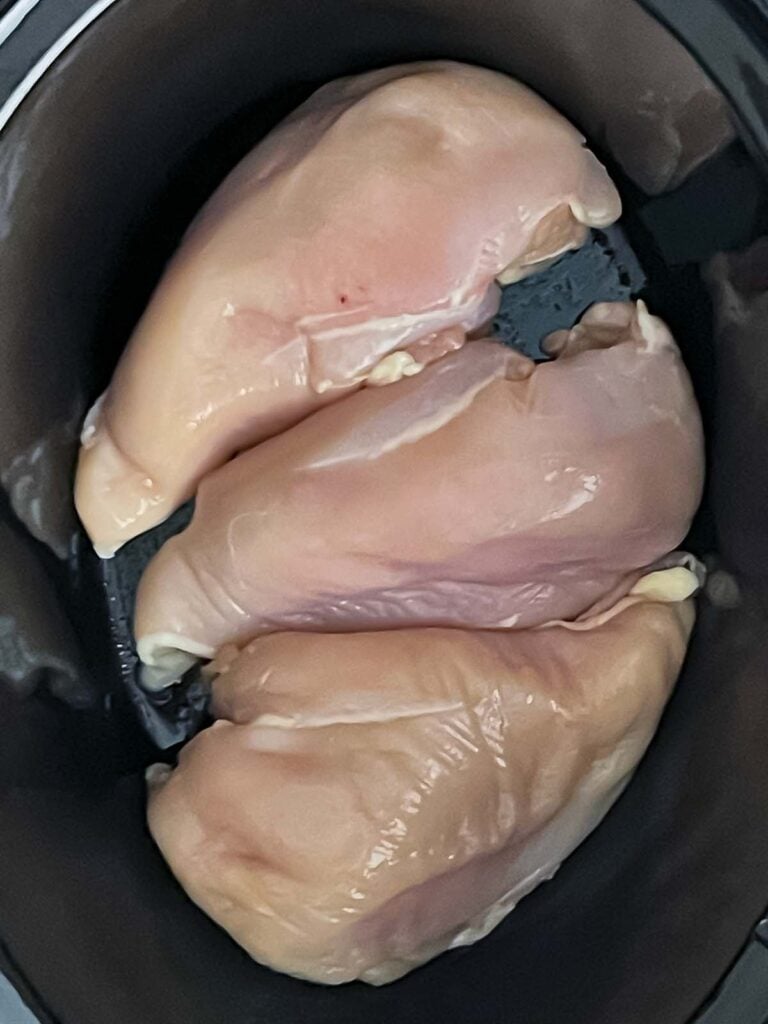 Three chicken breasts in the slow cooker for the Mexican chicken.