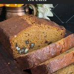 Sweet potato bread sliced on a wooden board.
