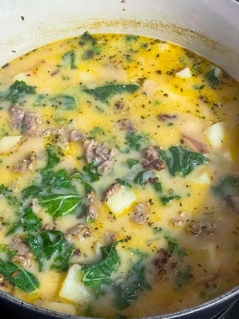 Sausage, potato, and kale soup (Zuppa Toscana) in a dutch oven.
