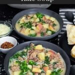 Sausage, potato and kale soup (Zuppa Toscana) in dark bowls on a dark surface.