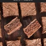 Sliced buttermilk brownies on a wooden cutting board.