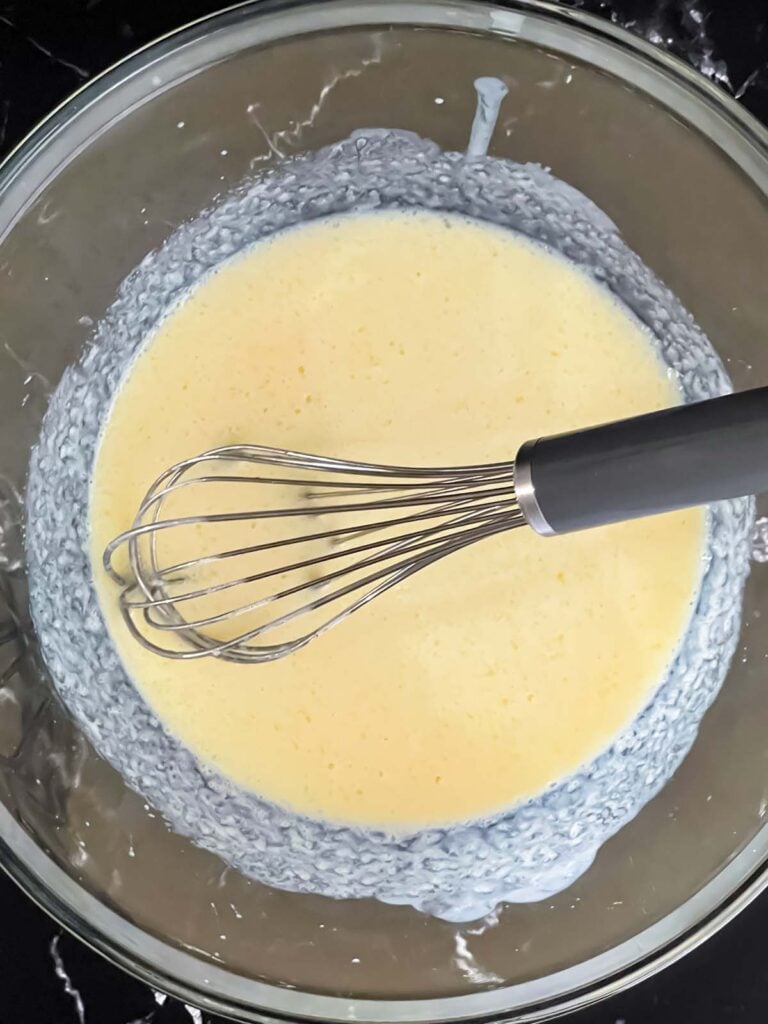 Wet ingredients combined in a mixing bowl.