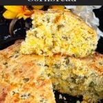 Cheddar jalapeno cornbread, cooked, in a cast iron skillet.