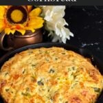 Cheddar jalapeno cornbread, cooked, in a cast iron skillet.
