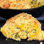 Cheddar jalapeno cornbread, cooked, in a cast iron skillet.